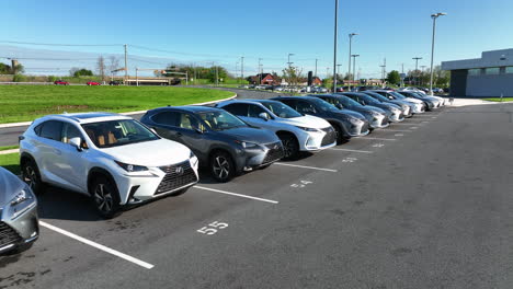 Line-of-new-and-used-Lexus-cars-crossover-SUV-vehicles-for-sale-at-dealership