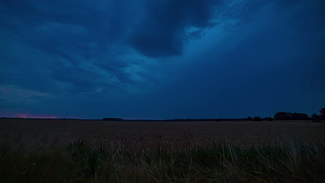 Time-lapse-shot-of-blinking-lightning-strikes-over-farm-field-during-dark-sky-in-the-evening
