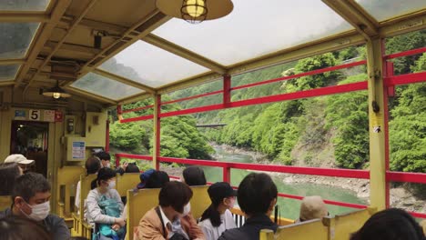 Sagano-Romantic-Sightseeing-Train-passing-Hozukyo-Valley-and-Katsura-River
