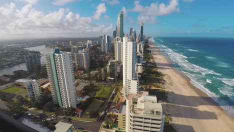 A-timelapse-of-Surfers-Paradise,-Goldcoast-Queensland,-Australia-show-from-a-unique-angle-that-shows-both-the-beach-and-the-city-as-the-day-goes-by