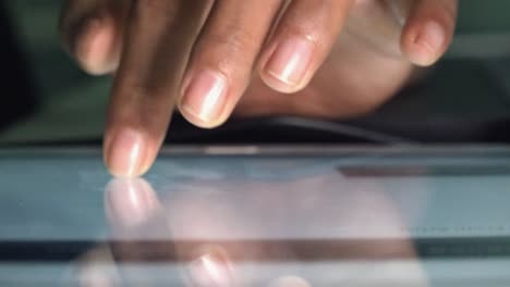 Close-Shot-of-Female-Hands-Using-a-Tablet-Computer