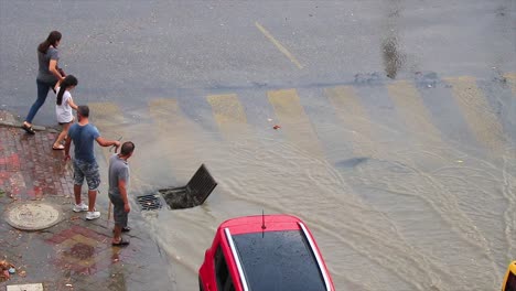 Men-cleaning-the-sewers-where-the-water-goes-after-a-big-scary-storm-in-Kusadasi-Turkey