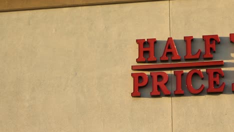 Half-Price-Books-Retail-Sign-on-Building-Pan-Across-Letters