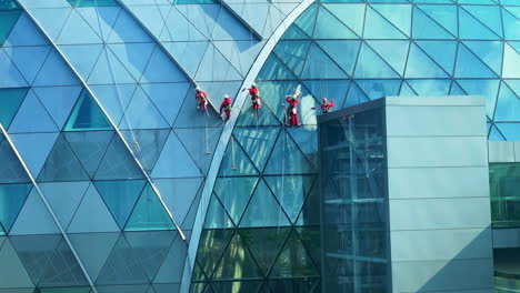 Footage-of-men-while-cleaning-the-roof-glass-building-in-Singapore