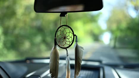 dream-catcher-attached-to-the-rearview-mirror-of-a-pickup-truck