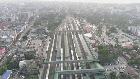 Railway-and-train-station-in-the-center-of-Guwahati-city-in-India,-city-landscape-seen-from-above