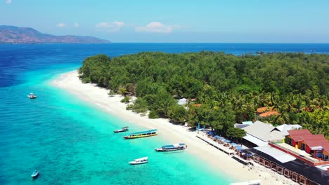 Tropical-white-sand-beach,-hotels-near-the-blue-lagoon-and-corall-reef