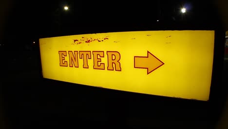 Old-School-Retro-Light-Up-Enter-Sign-with-an-Arrow-Night