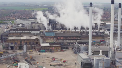 Tight-rising-pullback-aerial-establishing-view-of-DS-Smith,-Kemsley-Paper-Mill,-in-Kemsley,-Kent,-UK