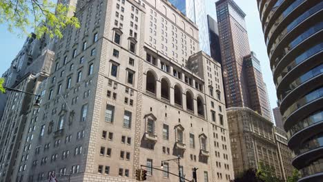 Essex-house-exterior-in-South-Central-Park,-NYC,-tilt-up-view-of-Art-Deco-apartment-and-hotel-building-in-Manhattan