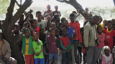 Local-people-of-Ziway,-outside-Addis-Ababa,-Ethiopia,-gather-around-for-a-charity-event