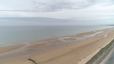 Spectacular-aerial-drone-view-of-Omaha-Beach-landing-area-in-Colleville-sur-Mer,-Normandy,-France
