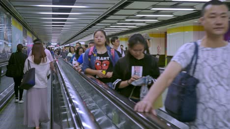 Pedestrians-using-a-travelator-on-a-MTR-or-Mass-Rapid-Transit-subway-tunnel