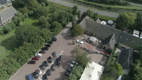 Aerial-of-Wedding-Car-Arriving-with-the-Guests-waiting-and-Applauding