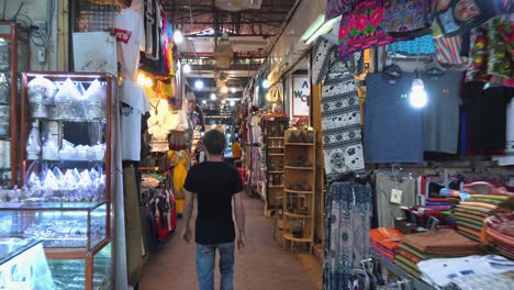 Male-Tourist-Browsing-Goods-at-the-Old-Market