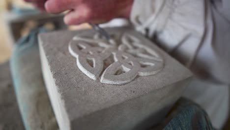 A-stonemason-demonstrates-the-carving-of-sandstone-at-the-festival