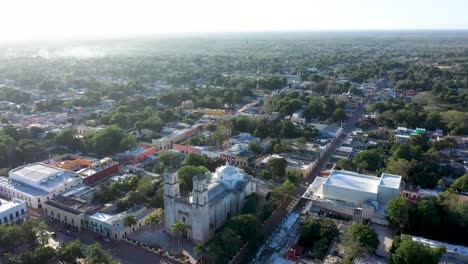 High-aerial-orbit-to-left,-early-in-morning,-around-the-Cathedral-de-San-Gervasio-in-Valladolid,-Yucatan,-Mexico