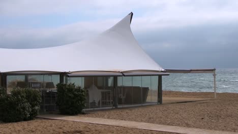 Empty-beach-bar-on-the-beach-on-a-cloudy-windy-day