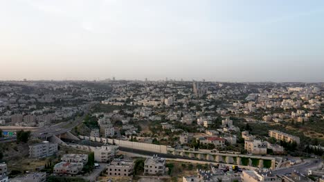 Aerial-fly-over-urban-city-area-of-center-Israel,-middle-eastern-city