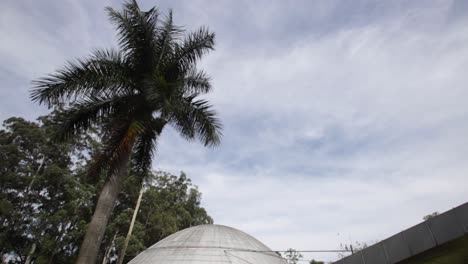 Slow-reveal-shot-of-Ibirapuera-Planetarium-in-Ibirapuera-Park-in-Sao-Paulo,-Brazil