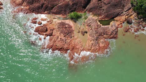 Drone-flight-of-rocky-North-Queensland-tropical-coast-near-Toomulla,-North-Queensland-Australia