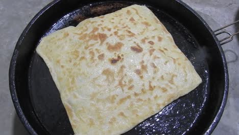 Special-Moroccan-pancakes-called-MSEMEN-during-the-preparation-in-iron-fryer
