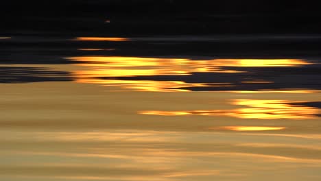 Reflection-of-sunset-on-lake-surface-in-slow-motion