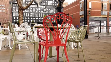 Empty-city-coffee-shop-outdoor-colourful-tables---chairs-dolly-slow-right