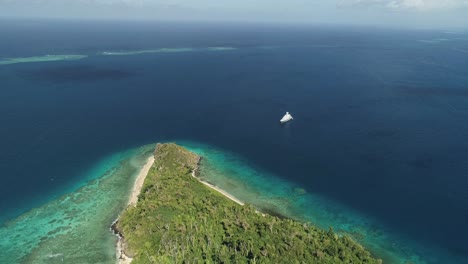 Aerial-footage-of-ocean-and-land-on-an-island-in-Tonga