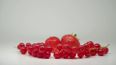 Beautiful-Red-Strawberries-And-Cherries-In-Pure-White-Background---Close-Up-Shot