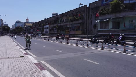 motorcycle-and-bicycle-traffic-on-a-main-road-in-Southeast-Asia-during-Corona-Virus-pandemic