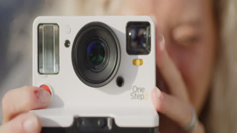 Polaroid-Camera-Close-Up-Coming-Into-Focus-Outside,-Slow-Motion