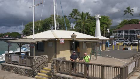 Lahaina-wharf-with-tourists-as-a-whale-watching-boat-leaves-the-port