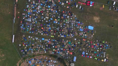 Birds-Eye-Aerial-View-of-Colorful-Tents-Pitched-at-Music-Festival