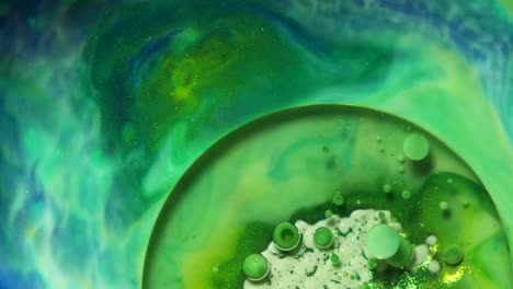 Green-and-blue-acrylic-chemical-reaction.-Slow-motion