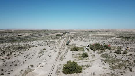 Drone-shot-of-a-train-in-desert