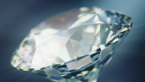 Close-up-of-a-rotating-cut-diamond-against-a-blue-background