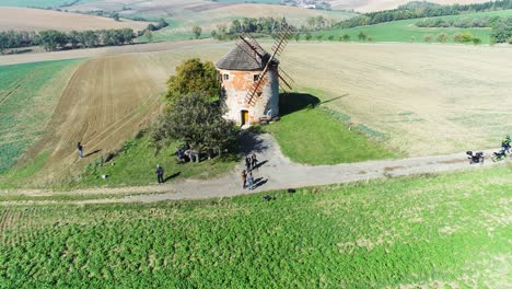 Aerial-towards-windmill-and-people