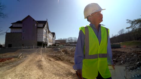 Wide-angle-extreme-closeup-of-woman-engineer-architect-walking-towards-camera-on-construction-site-and-looking-at-camera-and-and-looking-very-disappointed