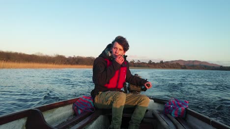 Young-man-boat-removing-mask-fleeing-Corona-virus-pandemic-wilderness-4K