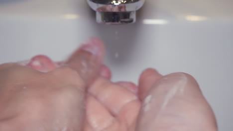 Extreme-close-up-slow-motion-Man-washing-male-hand-with-a-lot-of-soap