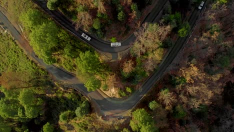 Aerial-Top-Down-Zoom-Out-shot-of-the-Highway-in-the-Hills-Connecting-Bir-and-the-top-of-Paragliding-spot-in-Billing,-Himachal-Pradesh,-shot-with-a-drone-in-4k