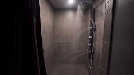 Push-in-shot-to-a-fancy-shower-with-lights-and-water-running