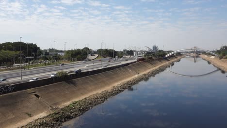 Tiete-river-reflecting-the-sky,-on-Marginal-Tiete-highway-in-Sao-Paulo,-Brazil