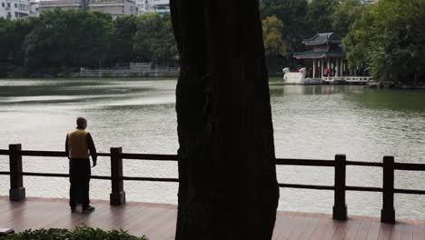 man-doing-yoga-by-the-water-in-china-in-guilin