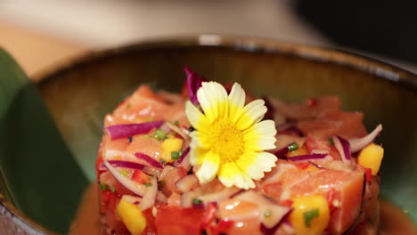 Food-Plating---Chef-Lifts-The-Stainless-Moulder-Before-Serving-The-Tuna-Ceviche-With-A-Beautiful-Daisy-Flower-As-Garnish