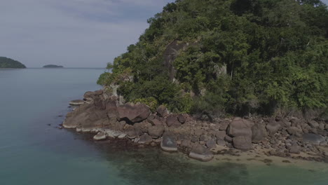 Drone-slider-left-right-shot-of-an-island-with-rocks
