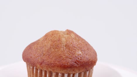 Muffins-banana-with-white-background-shallow-focus-and-slowly-rotating