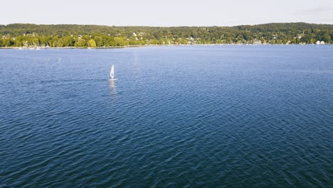 Drone-reveals-breathtaking-shot-of-a-windsurfer-on-the-water-of-the-Ammersee-in-Bavaria