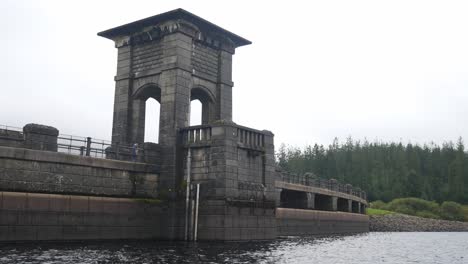 Historical-North-Wales-Alwen-dam-reservoir-landmark-building-female-crossing